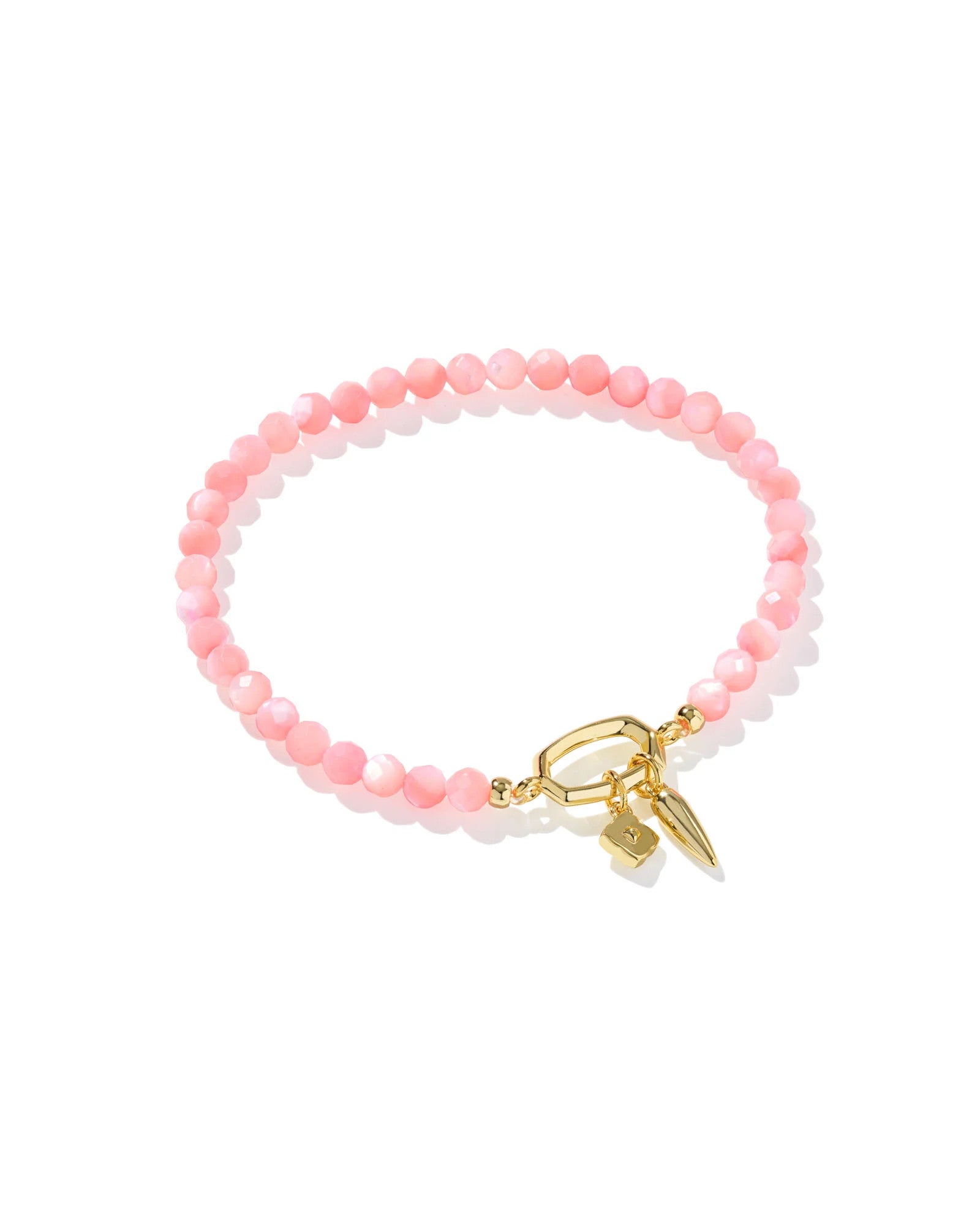 Sylvia stretch bracelet featuring pink chalcedony beads and 14k yellow gold over brass charms.