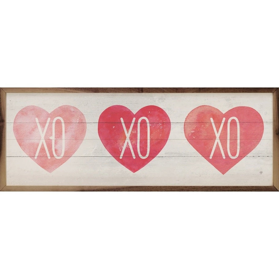 Whitewash Xo Hearts wall art with hand-painted face in natural walnut frame