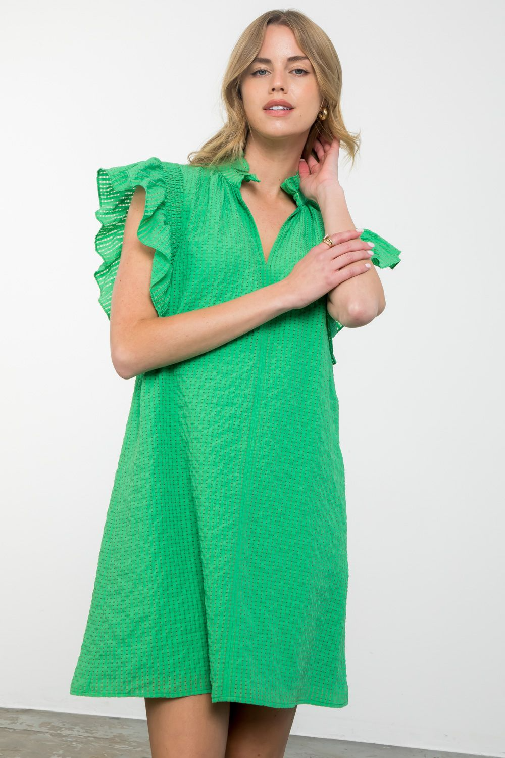 Women's Isabella dress in woven polyester with ruffle sleeves and textured fabric.