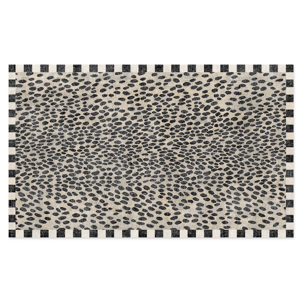 Snow Leopard 2' x 3' washable rug with black spots and a checkered border on a beige background.