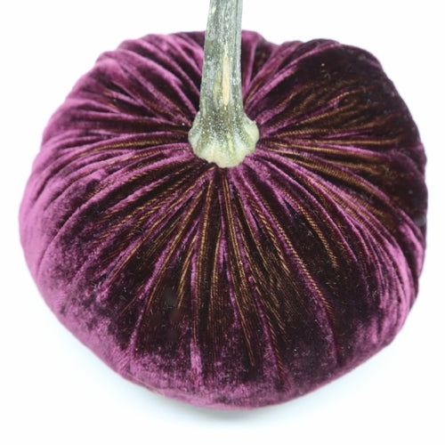 Handmade velvet pumpkin in deep orange with a natural stem.