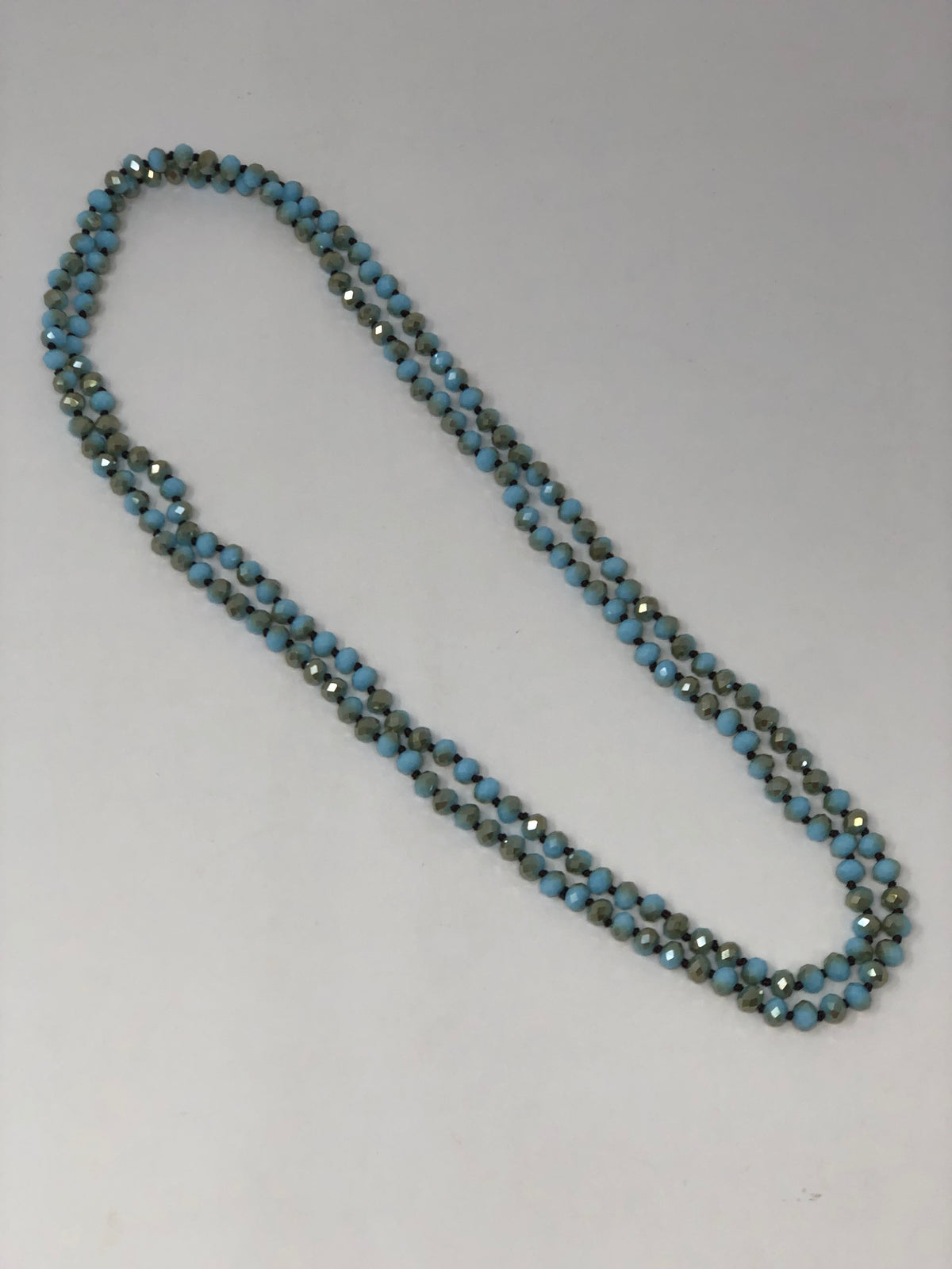 60-inch dark brown crystal beaded necklace with knotting between each bead
