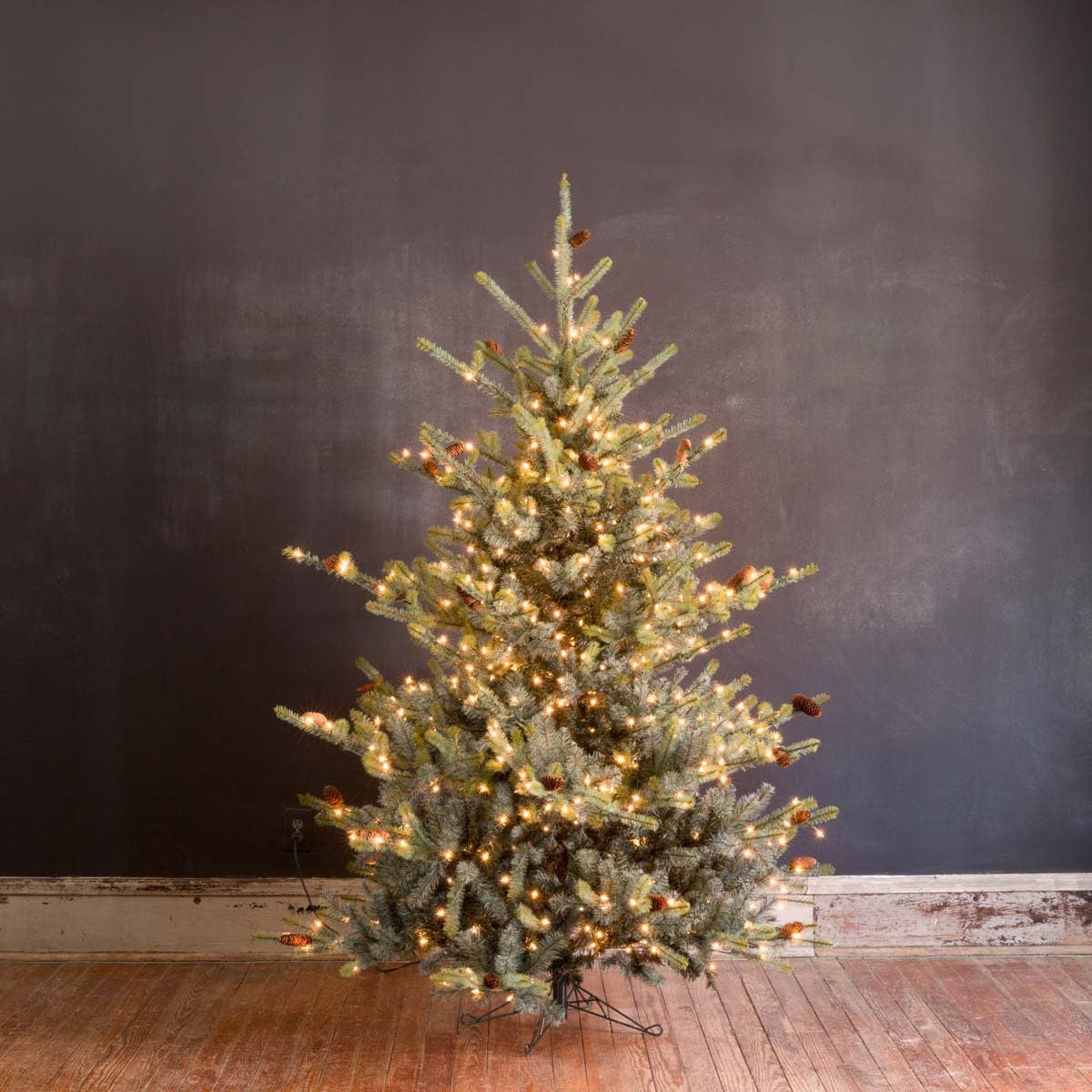 7.5-foot pre-lit Park Hill Blue Spruce artificial Christmas tree with green and brown tones.