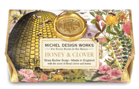 Michel Design Works Honey & Clover shea butter soap bar with a bee and floral illustration.