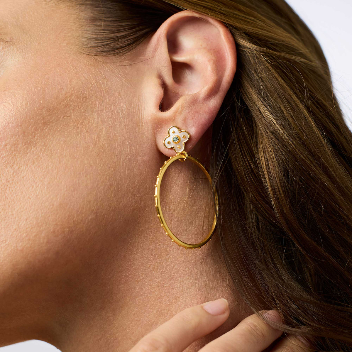 Colette statement earring with gold plate finish, mother of pearl center stone, and cubic zirconia accents.