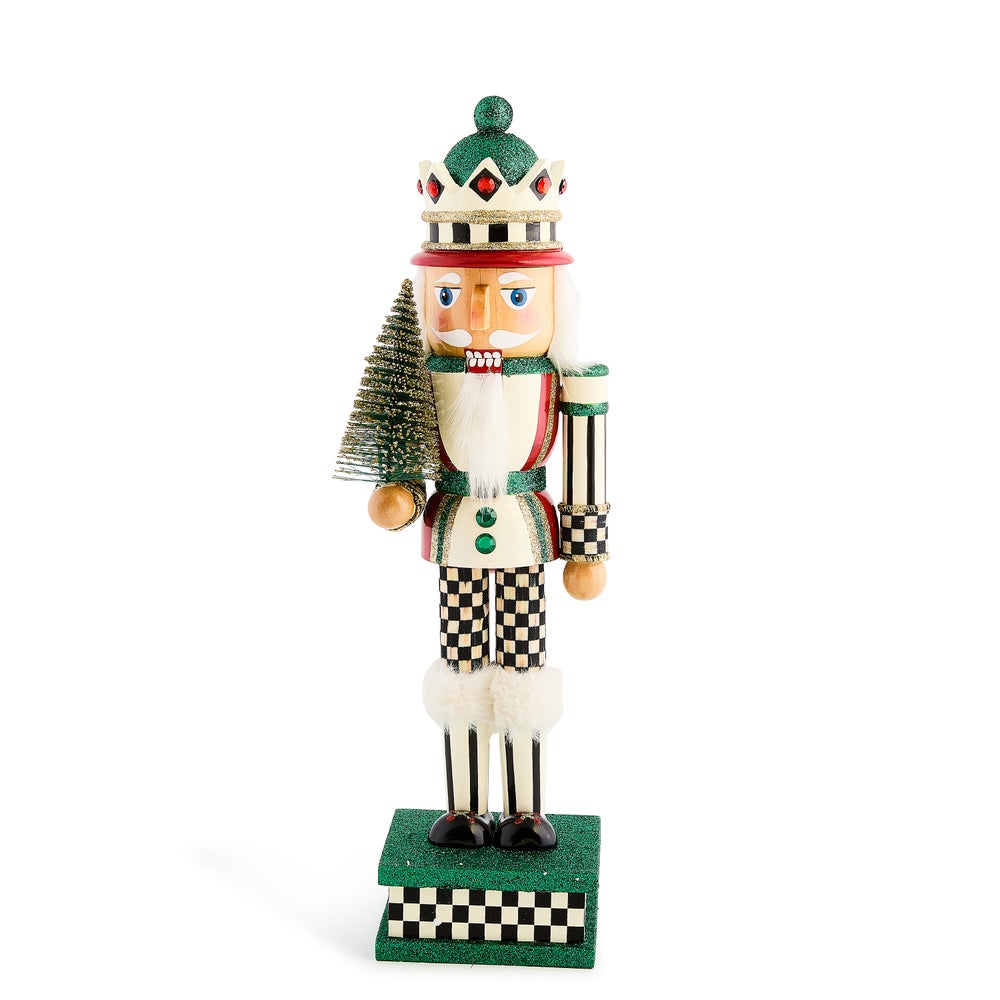 Wooden Sisal Tree Nutcracker with checkered patterns, a green glitter hat, and a small sisal tree.