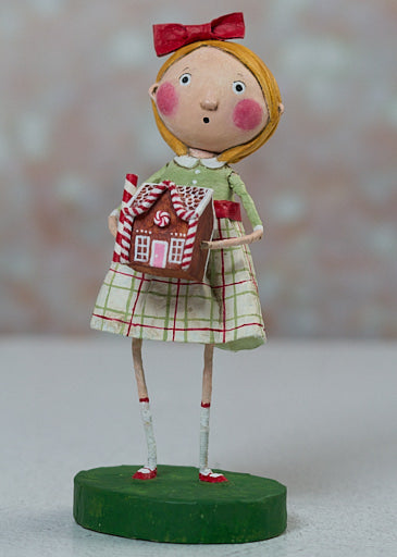 7-inch poly resin decorative item shaped like a gingerbread house with visible window cutouts and roof details.