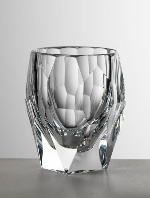 Clear crystal tumbler with faceted geometric pattern and thick base.