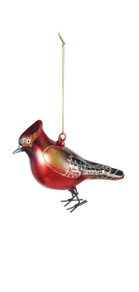 Hand-painted red glass bird ornament with glitter wings and iron feet hanging from a gold string.