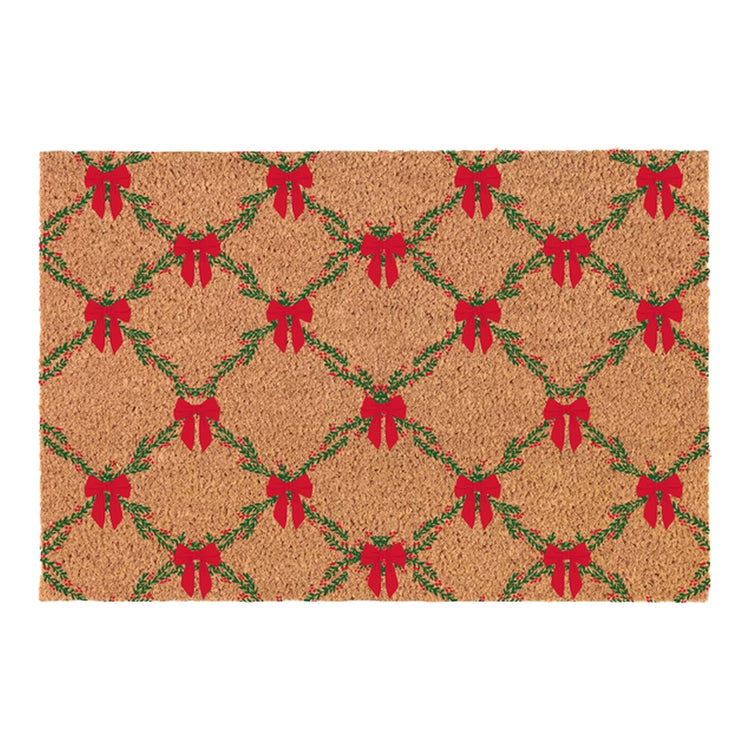 Red rectangular door mat with white snowflake patterns on a textured surface.