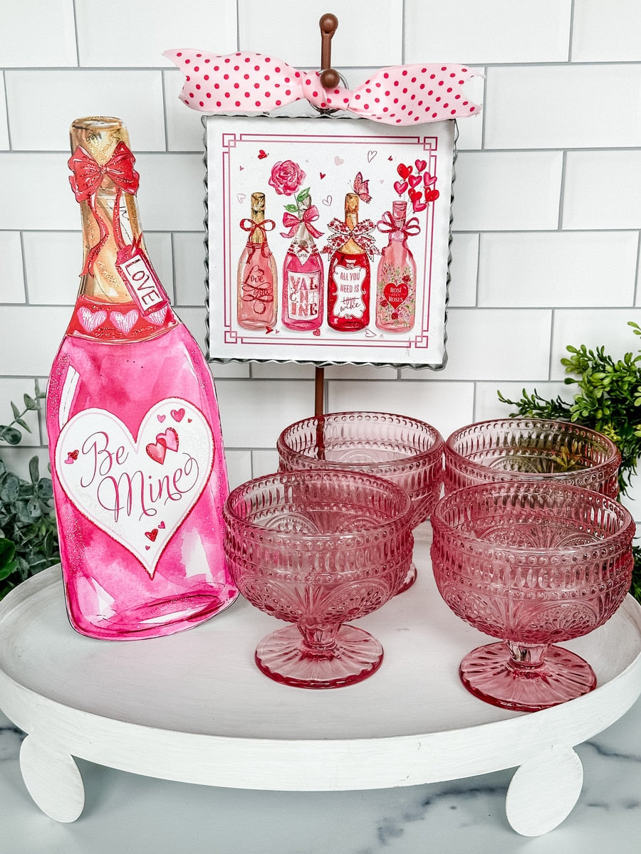 Beck's Be Mine Champagne wine stake with a champagne flute graphic on white background.