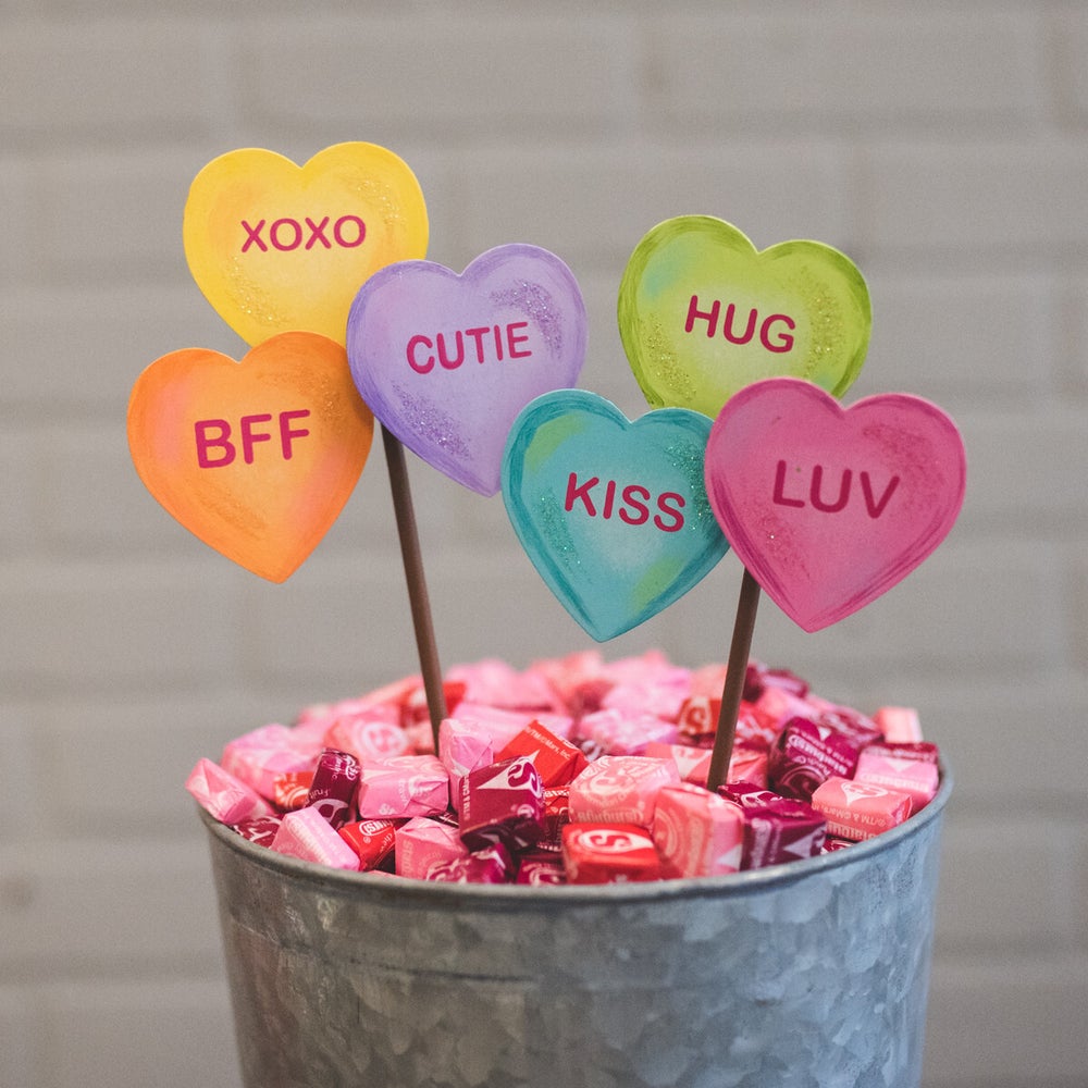 Talking Triple Heart Stakes: three heart-shaped stakes with a triple-heart pattern on the front.