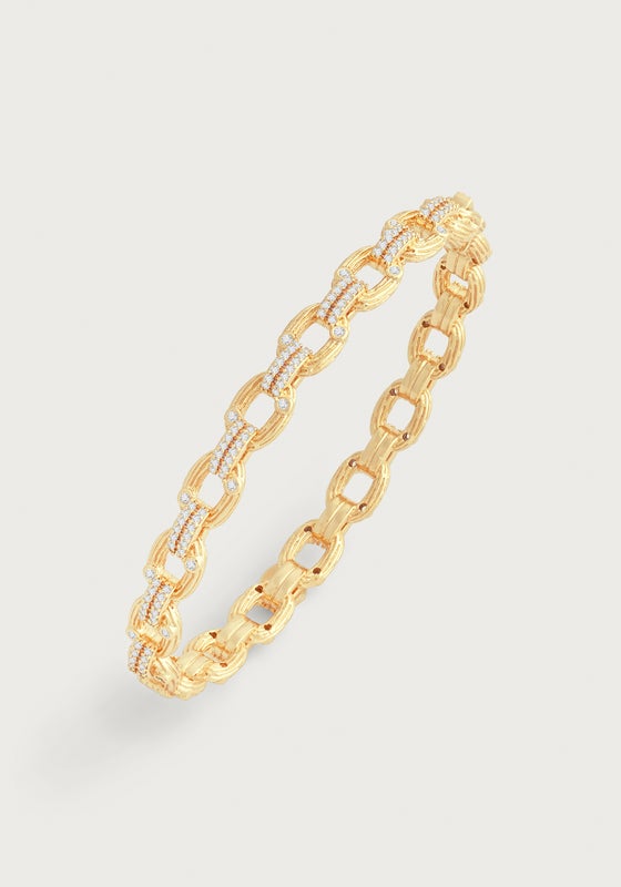 Gold-plated hinged bangle featuring oval twig-textured chain links accented with crystals.