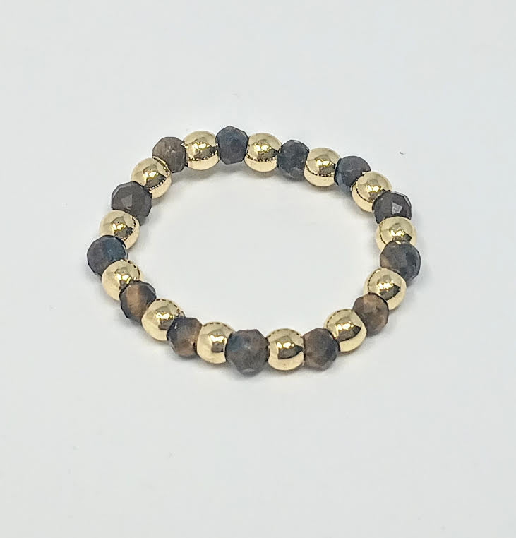 A 3mm ring featuring alternating gold-tone beads and faceted dark semi-precious stones.