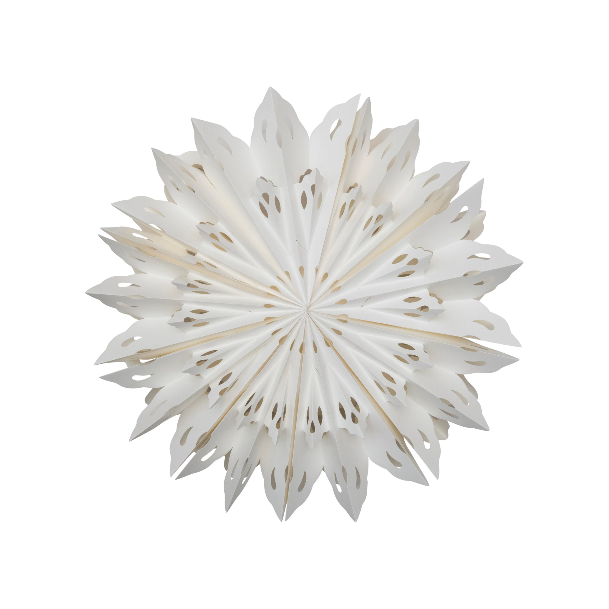 Large white paper snowflake ornament with intricate cut-out details and a star-like silhouette.