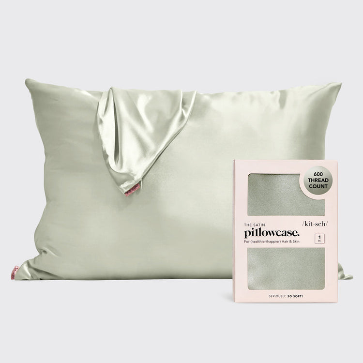 Satin pillowcase in a soft neutral tone with smooth texture.
