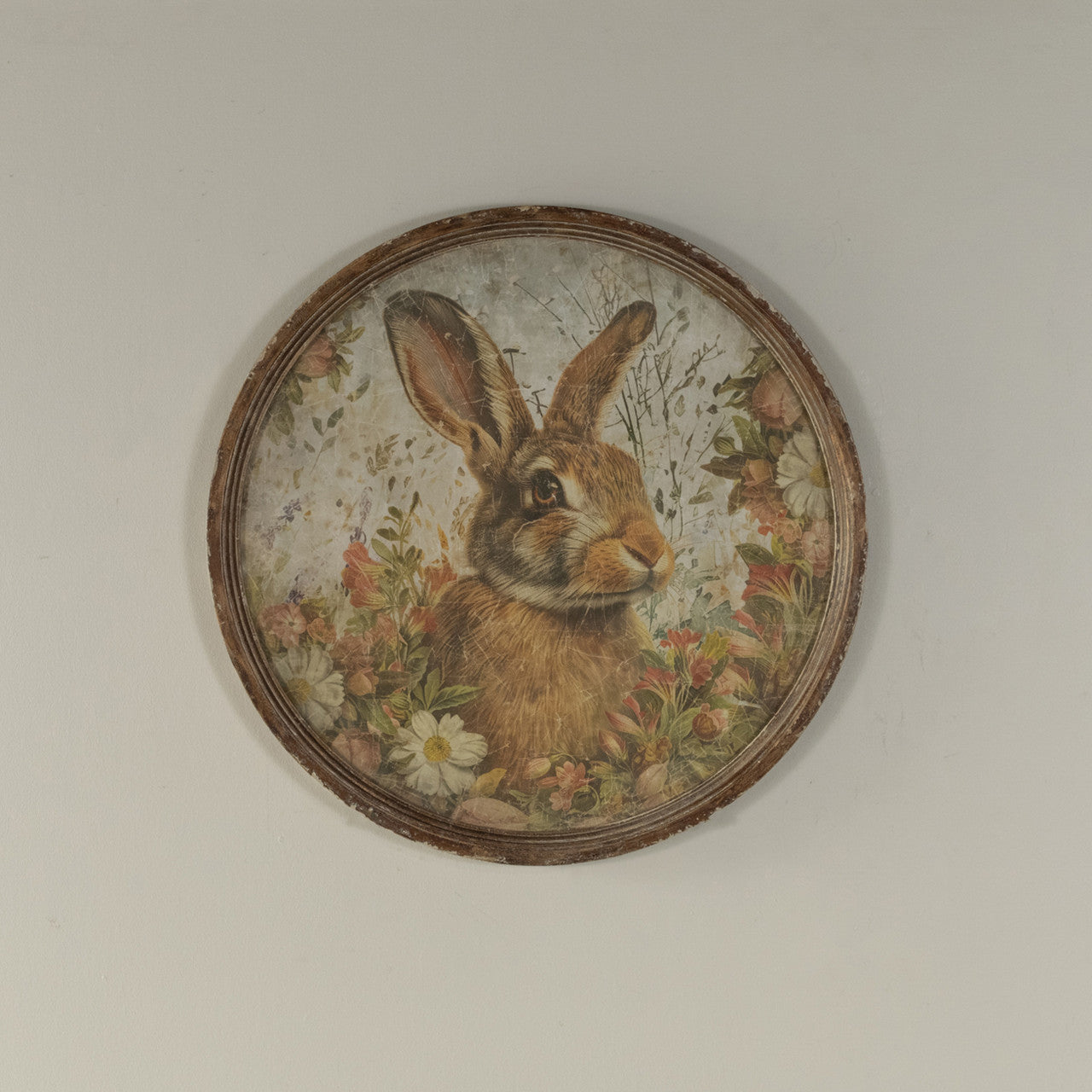 Round glass-framed print on paper featuring a black bunny illustration with the text Hello Bunny.