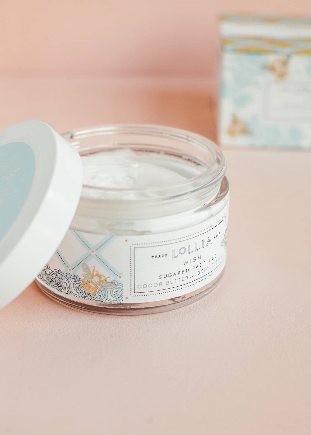 Wish Body Butter in a French-inspired blue foulard box with golden bee accents.