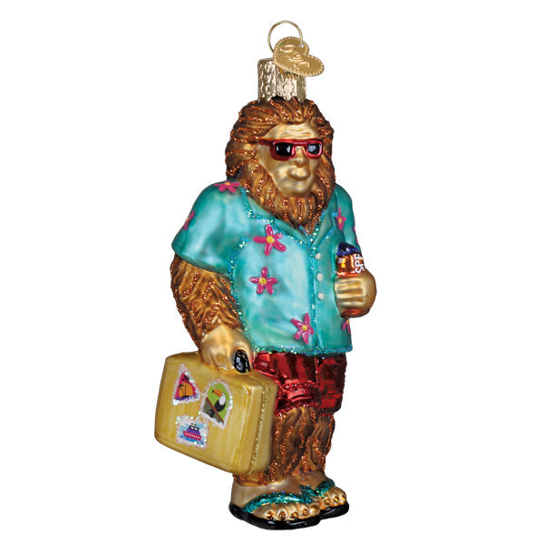 Sasquatch Gone Tropics ornament: Bigfoot figure in flip-flops and sunglasses with a tropical theme.