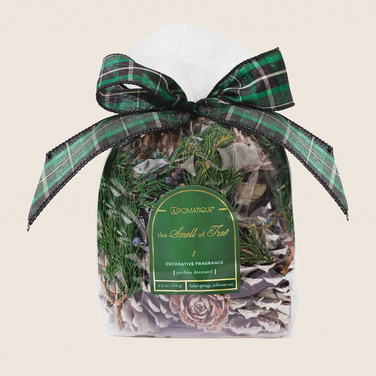 The Smell of Tree decorative fragrance in a clear bag with a green plaid bow and pinecone potpourri.