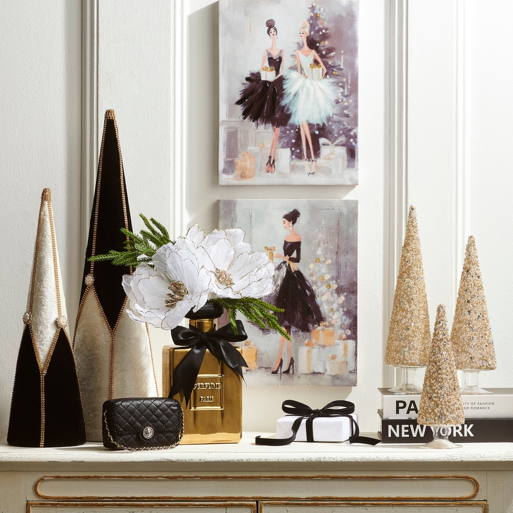 10-inch gold perfume bottle vase with a black bow, holding white flowers on a decorated mantel.