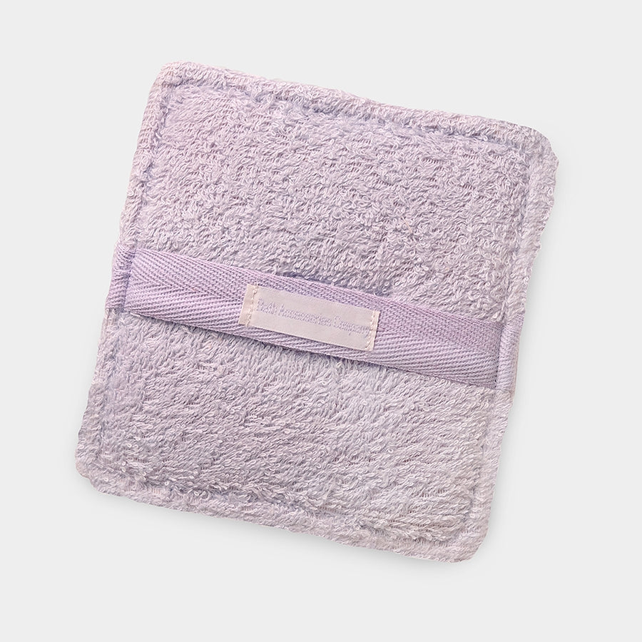 Lavender-colored Terry cloth soaping sponge with a pocket handle.
