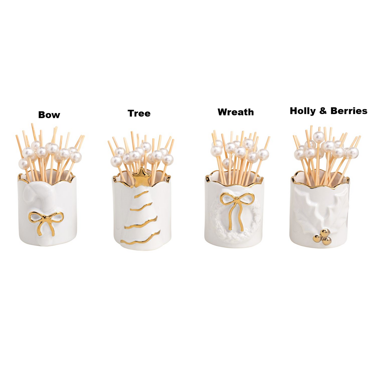 Four white stoneware toothpick caddies with gold accents and pearl-topped toothpicks.