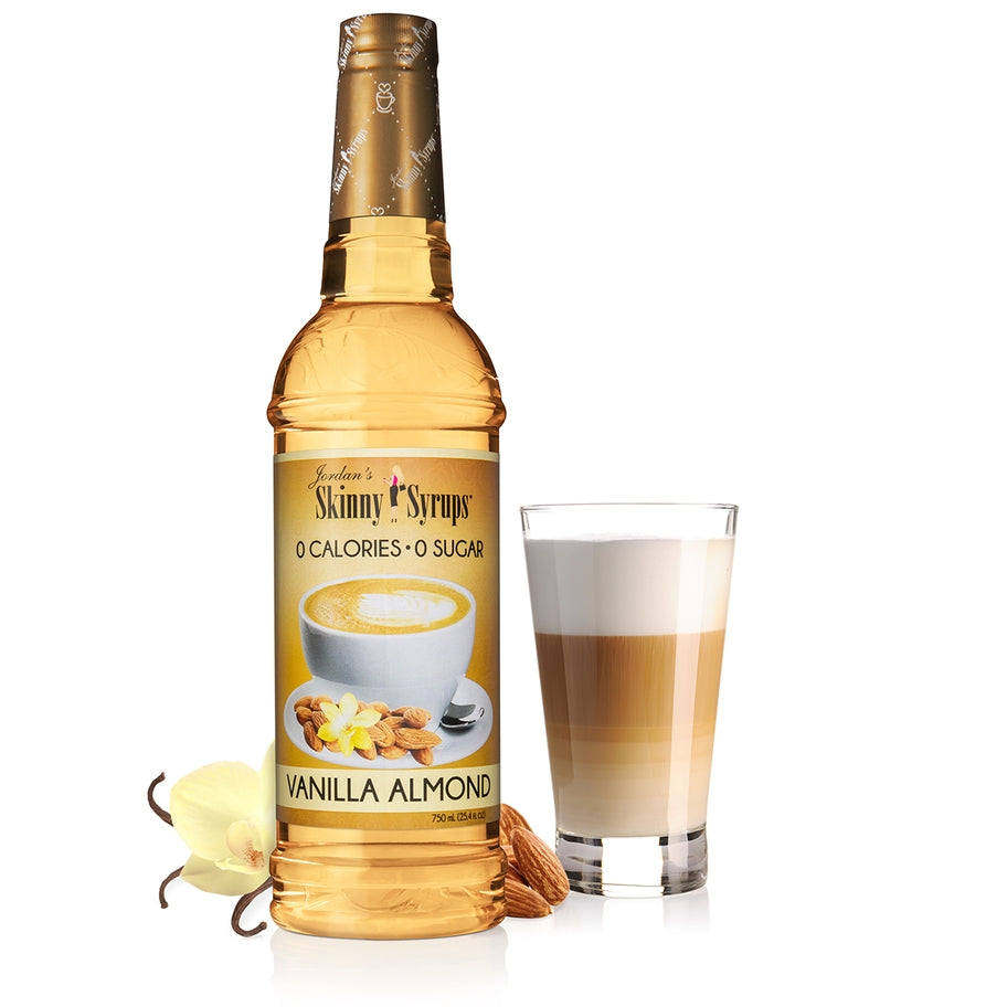 Bottle of sugar-free vanilla almond flavored drink with clear liquid inside.