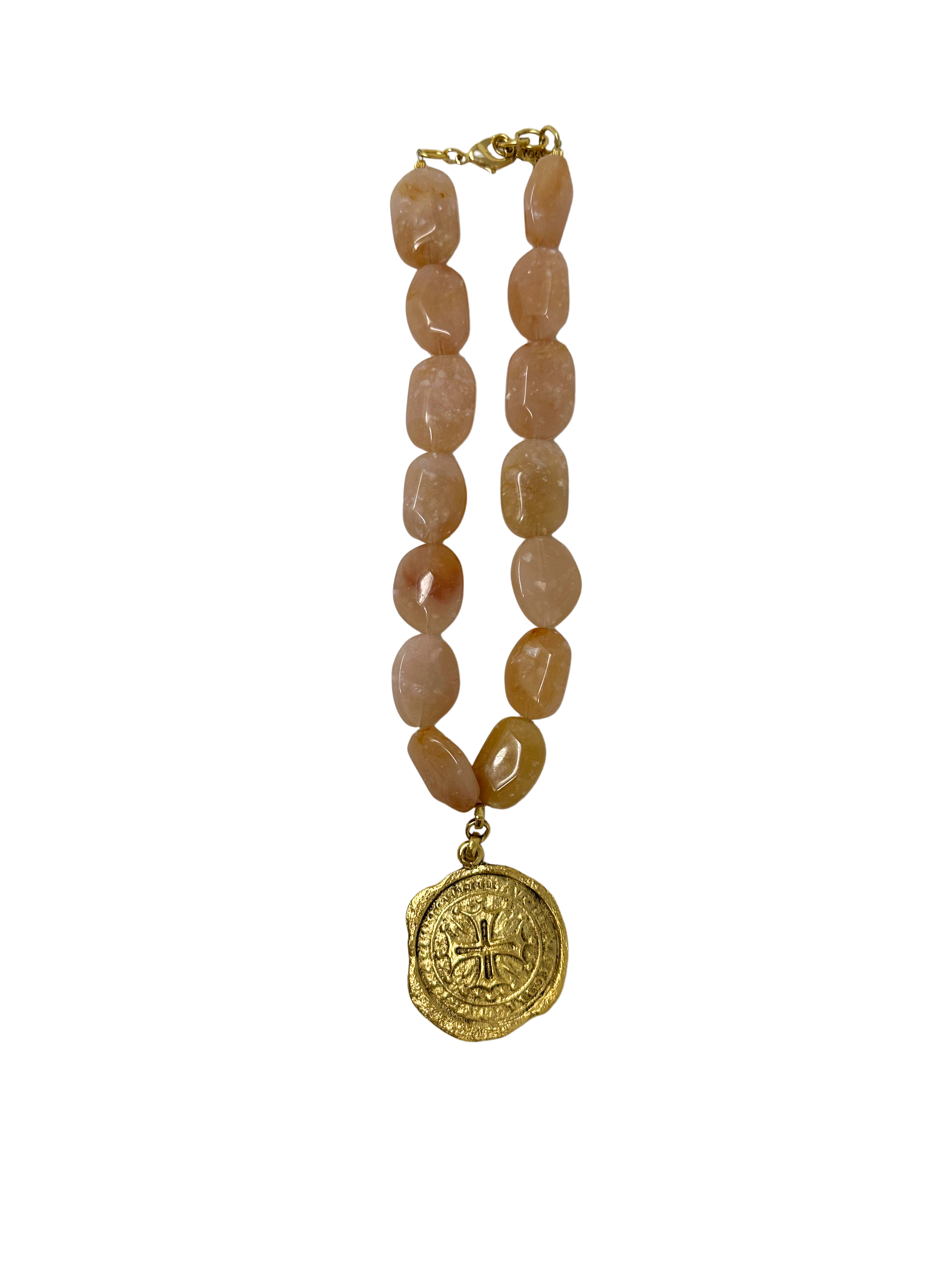 Rose quartz bead necklace featuring a gold cross coin pendant and lobster clasp.