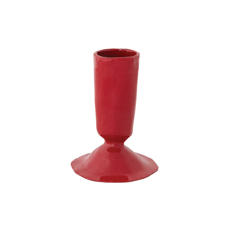 Hand-forged red enameled cast iron taper candle holder with a wide base and cylindrical top.