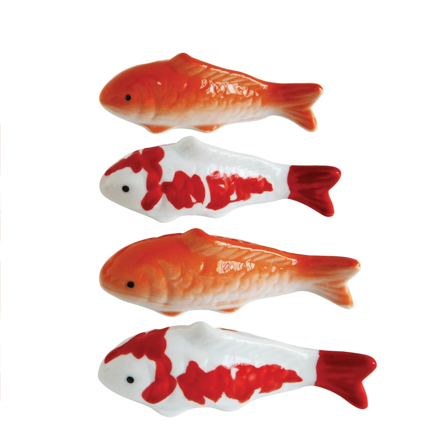 4-inch stoneware floating fish sculpture in natural earth tones with a smooth ceramic finish.