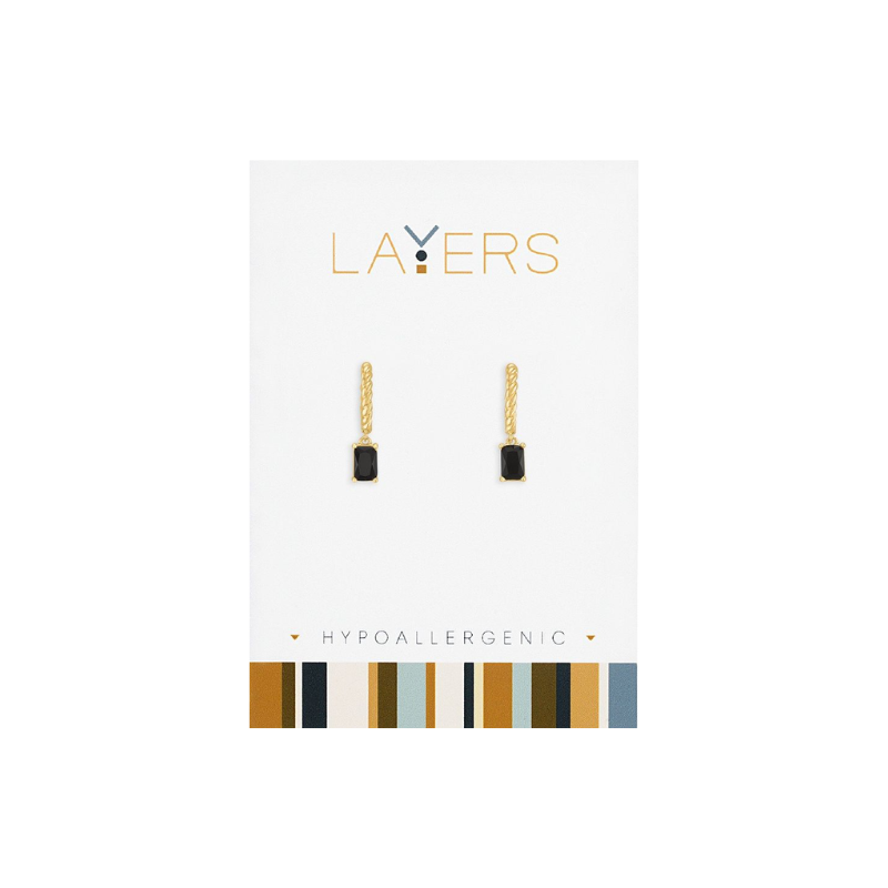 Gold twisted huggie earrings with rectangular jet black stone drops on a white display card.