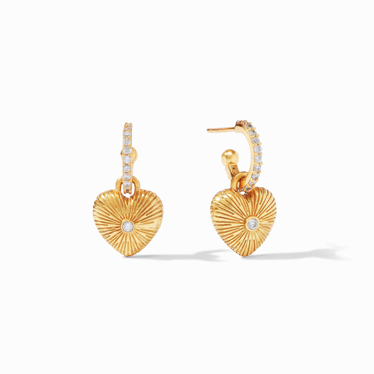 Gold heart hoop earrings with cubic zirconia accents and sunburst texture.