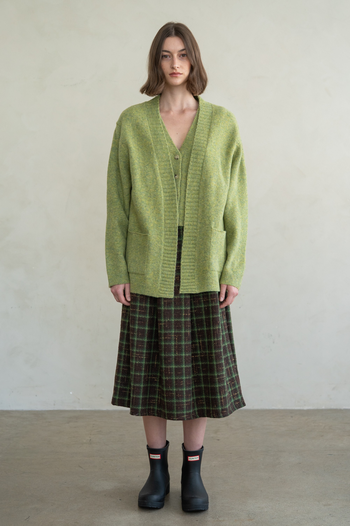 Hanna Wide Rib Open Cardigan in green brushed knit with front patch pockets.