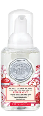 Michel Design Works Peppermint Foaming Shea Butter Hand Soap in a holiday-themed mini bottle.