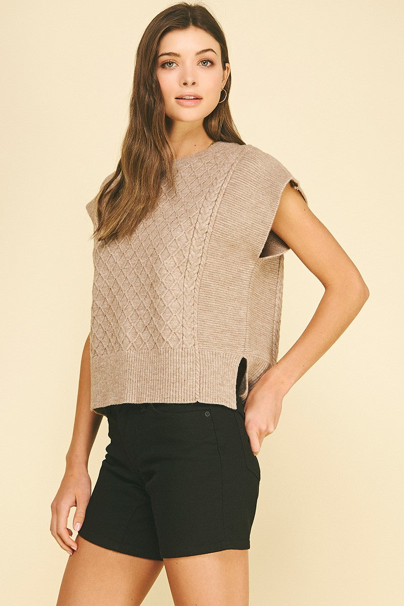 Lyndsey diamond cable knit sweater in soft gray with a relaxed fit silhouette.