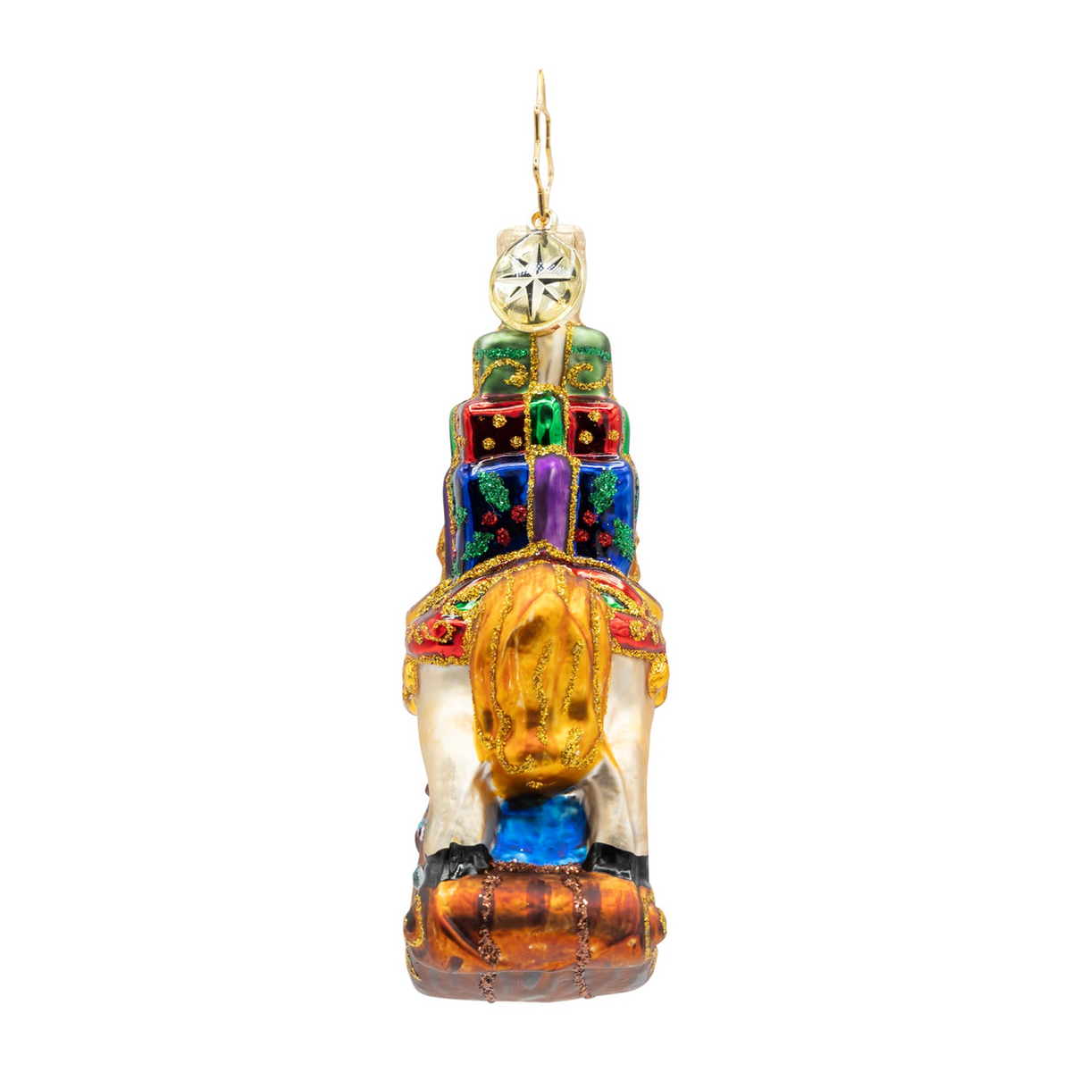 Back view of a hand-painted rocking horse glass ornament carrying a stack of colorful gift boxes.