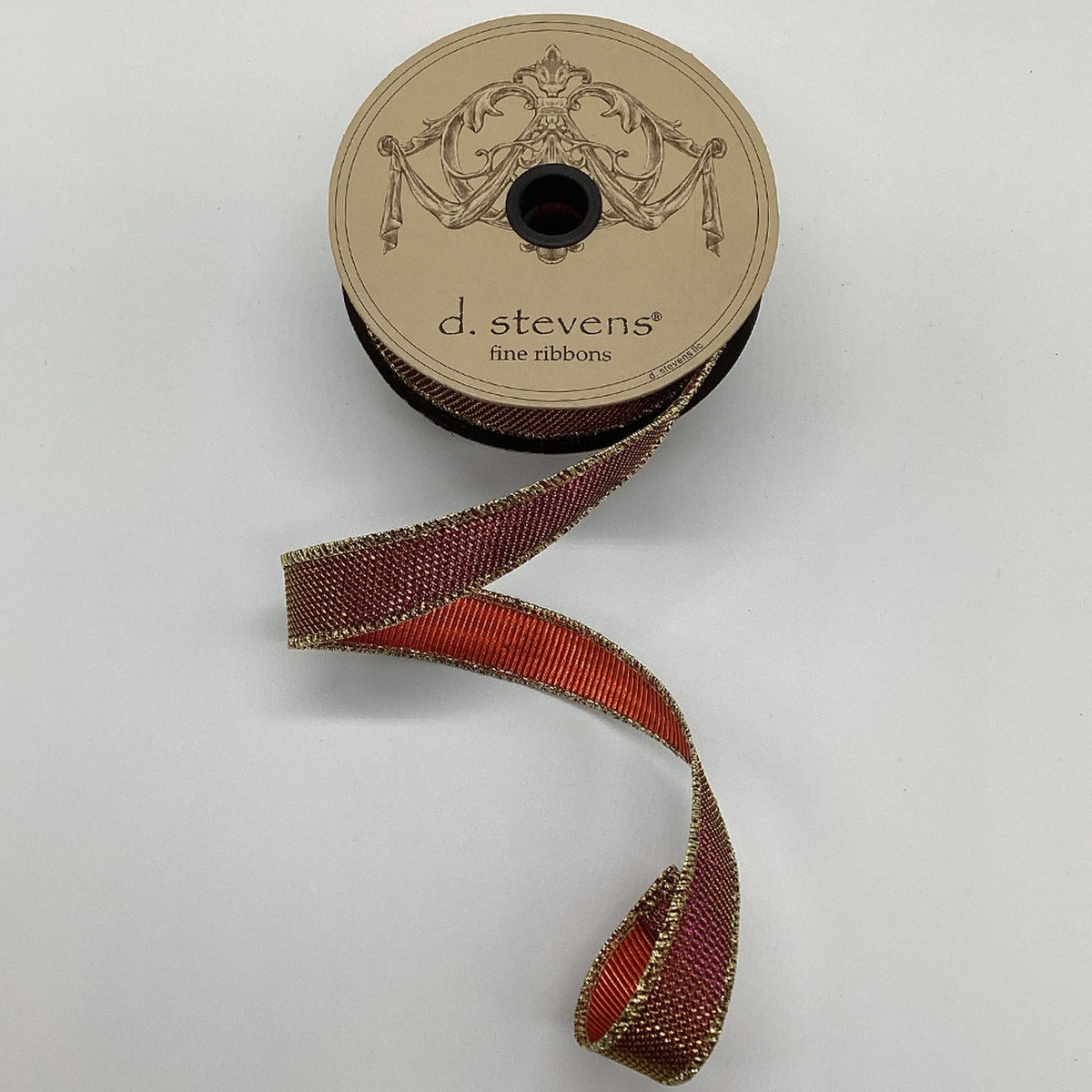 1 inch Arizona Lame Micro Dot Ribbon by d. stevens on a spool with gold metallic edges.
