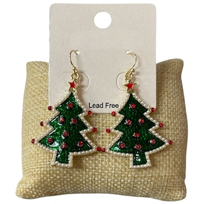 Pair of green Christmas tree drop earrings with red rhinestone ornaments on a burlap cushion.