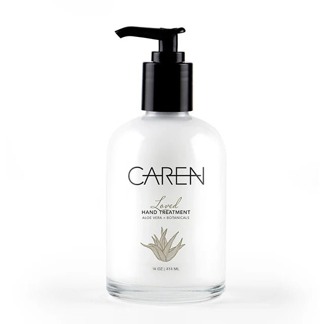 Glass bottle containing Loved Hand Treatment with aloe vera base.