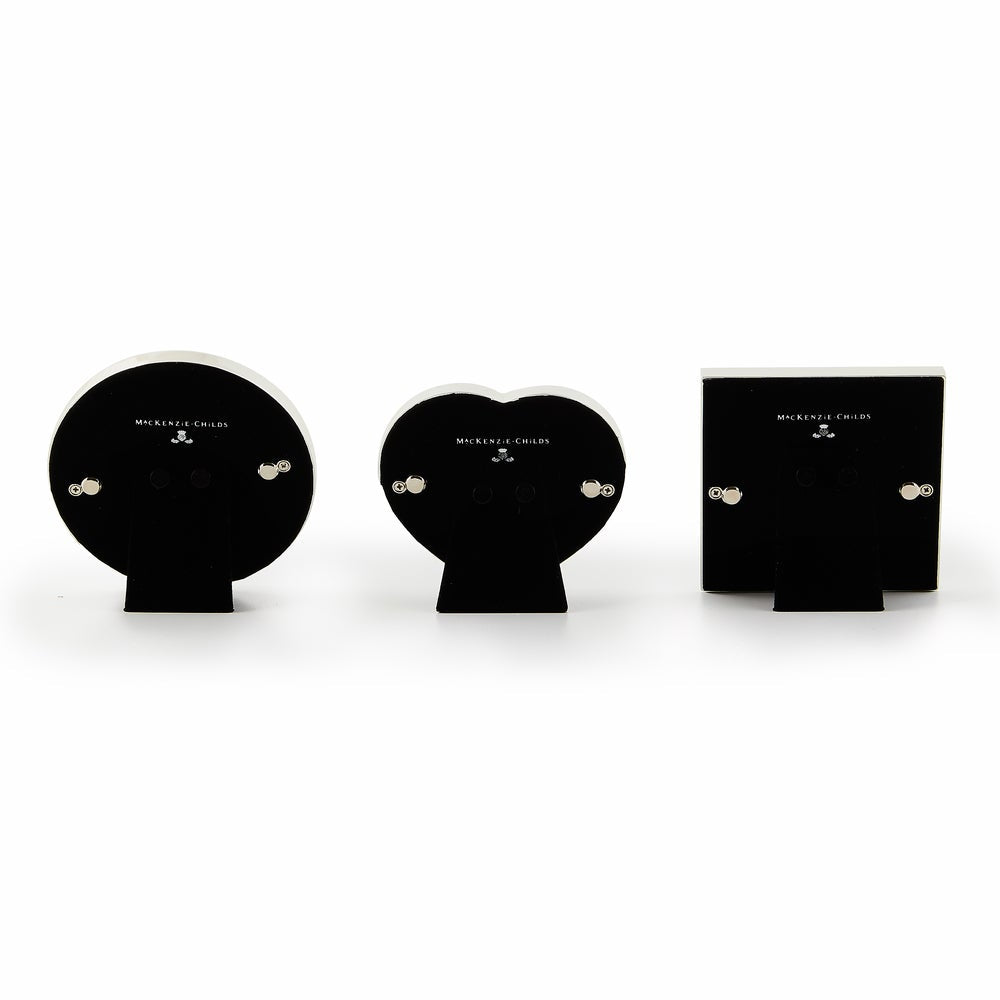 Set of three courtly frames in silver with velvet backing; heart, circle, and square shapes.