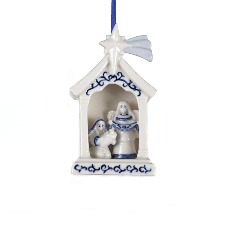 Porcelain Delft Blue Holy Family ornament featuring Mary, Joseph, and Baby Jesus in a stable.