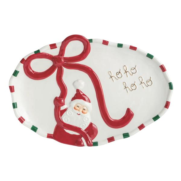 Oval white ceramic platter with a raised red bow, Santa Claus illustration, and gold 'ho ho ho'.