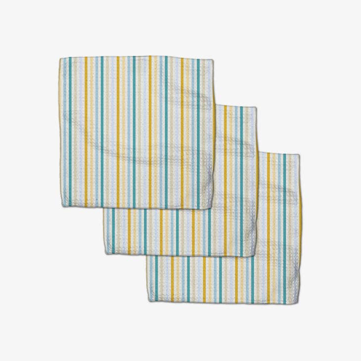 Set of three waffle weave dishcloths in recycled polyester with single-sided prints and hang loops.
