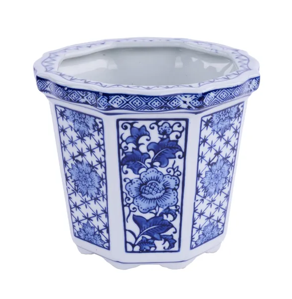 Blue and white porcelain jardiniere with a classic rounded silhouette.
