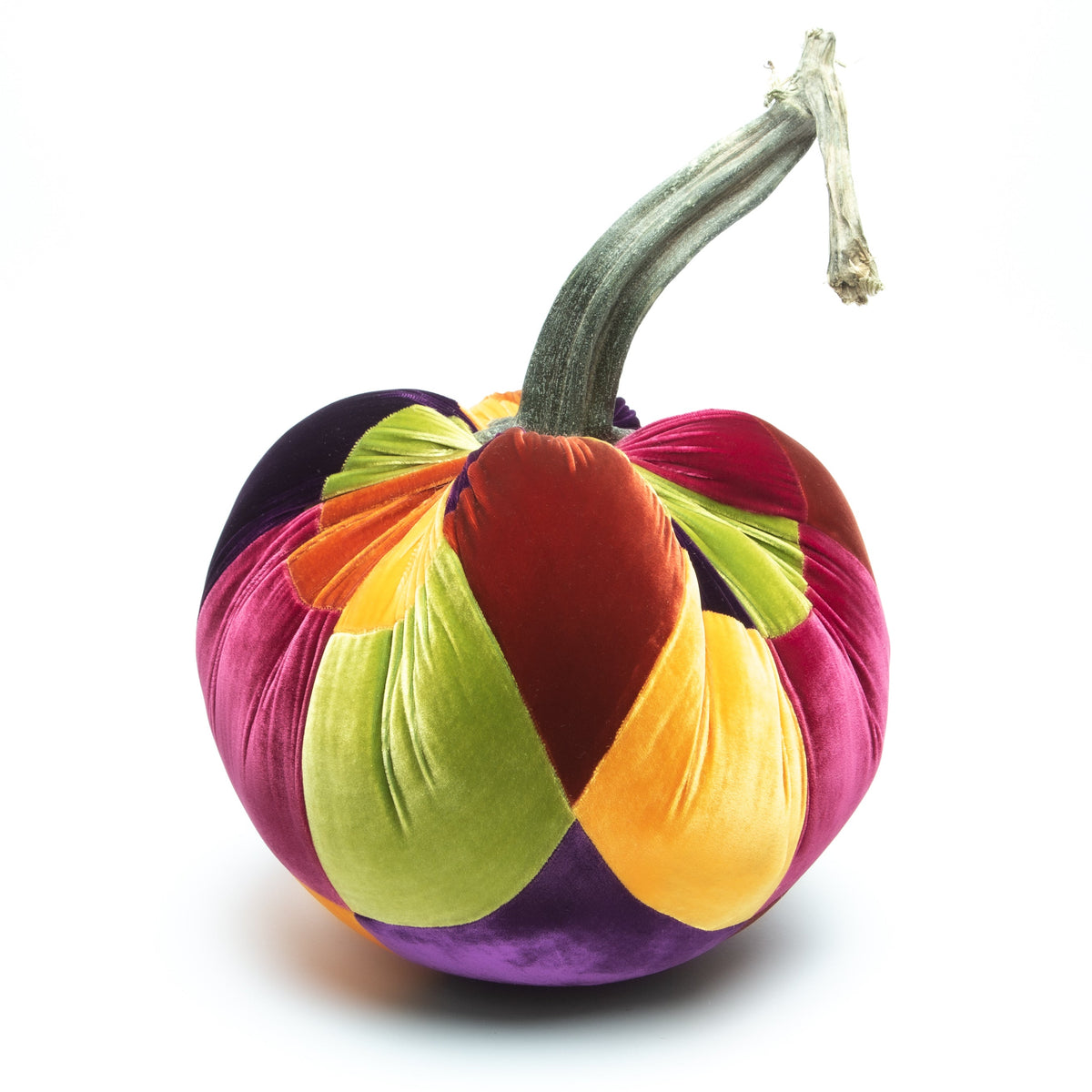Handmade patchwork velvet pumpkin in warm orange tones with a natural stem.