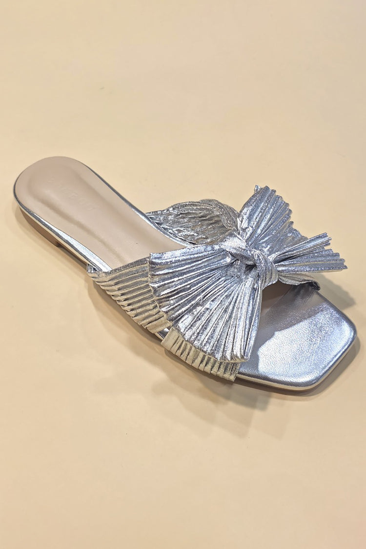 Metallic fabric ribbon slide flat sandals with a sleek strap across the toes.