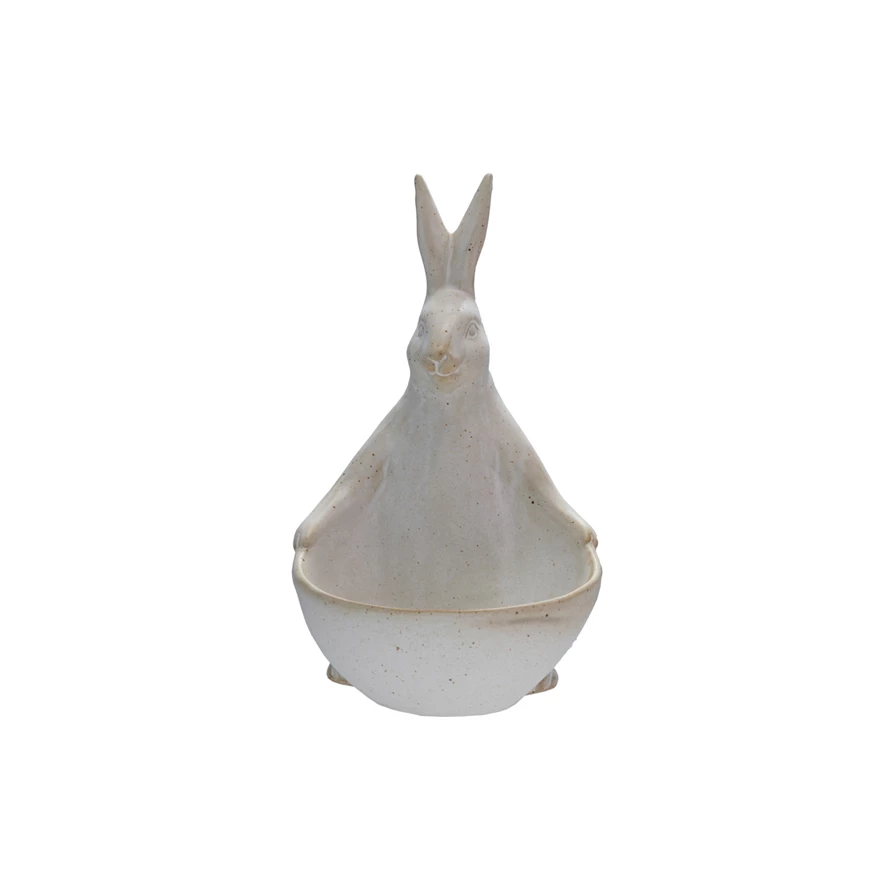 Speckled stoneware rabbit figurine holding a small bowl or planter.