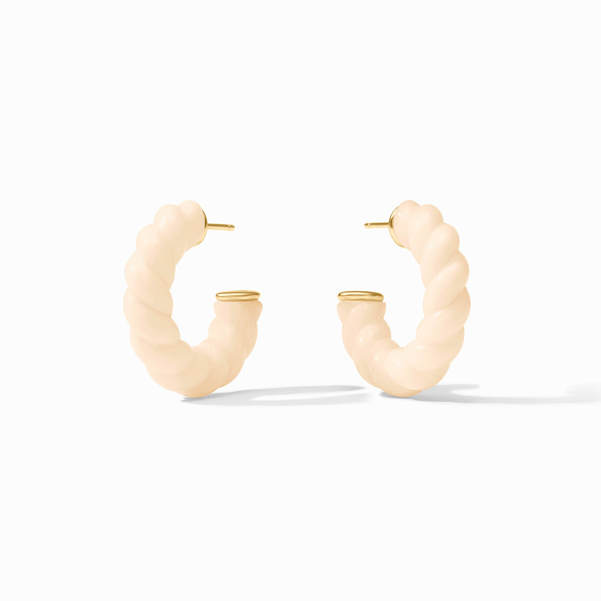 A pair of Ravello Hoop earrings in cream resin with 24K gold plated posts and end caps.