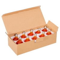 Open cardboard box containing ten amber-colored LED filament glass replacement bulbs in foam inserts.